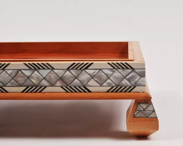 21-jpg Large handcrafted wooden tray, carefully crafted and decorated with intricate mother-of-pearl inlays for an open buffet.