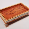 Large handcrafted wooden tray, carefully crafted and decorated with intricate mother-of-pearl inlays for an open buffet.