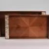 A set of handmade rectangular wooden trays inlaid with pearl pieces in a wonderful geometric shape