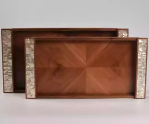 A set of handmade rectangular wooden trays inlaid with pearl pieces in a wonderful geometric shape