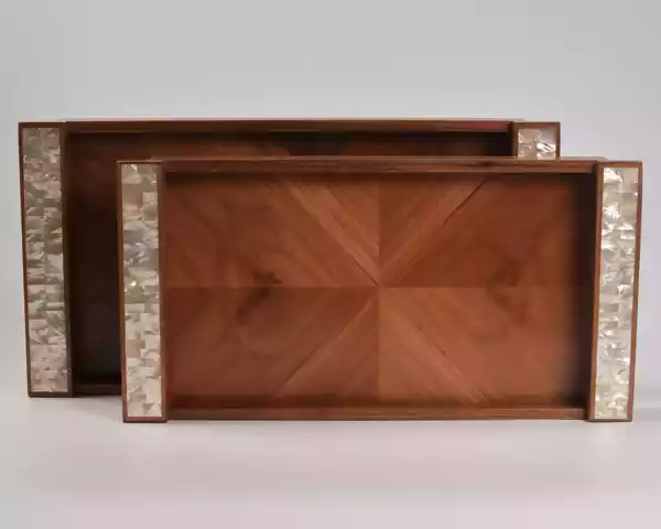 A set of handmade rectangular wooden trays inlaid with pearl pieces in a wonderful geometric shape
