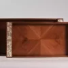 A set of handmade rectangular wooden trays inlaid with pearl pieces in a wonderful geometric shape