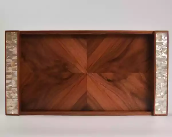 A set of handmade rectangular wooden trays inlaid with pearl pieces in a wonderful geometric shape