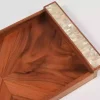 A set of handmade rectangular wooden trays inlaid with pearl pieces in a wonderful geometric shape
