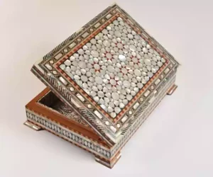 luxury  handmade wooden box, meticulously crafted and fully inlaid with stunning mother of pearls in a mesmerizing