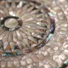 Round table completely inlaid with mother-of-pearl