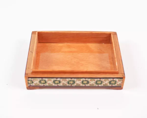 wooden box inlaid with copper with a traditional Islamic design