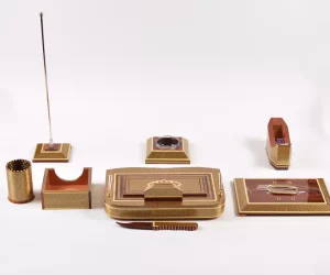 A distinctive and luxurious desk set, handcrafted from lemon wood and inlaid with copper