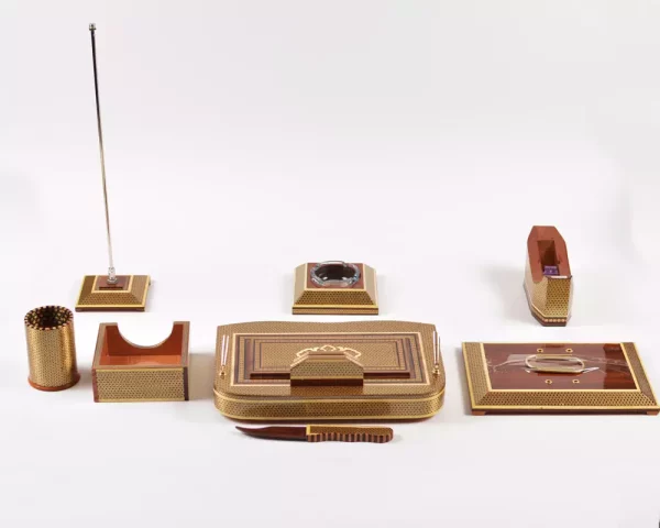 2 A distinctive and luxurious desk set, handcrafted from lemon wood and inlaid with copper