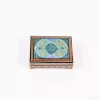 wooden box inlaid with copper with a traditional Islamic design