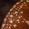 Handmade round wooden table inlaid with natural mother-of-pearl