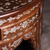 Handmade round wooden table inlaid with natural mother-of-pearl
