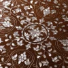 Handmade round wooden table inlaid with natural mother-of-pearl